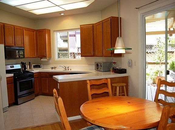 Dining area off kitchen. This is an older photo. Kitchen has custom cabinets and granite counter tops.