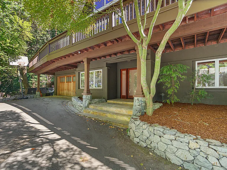 Main entrance. Notice space for 4 cars plus 2 car garage.