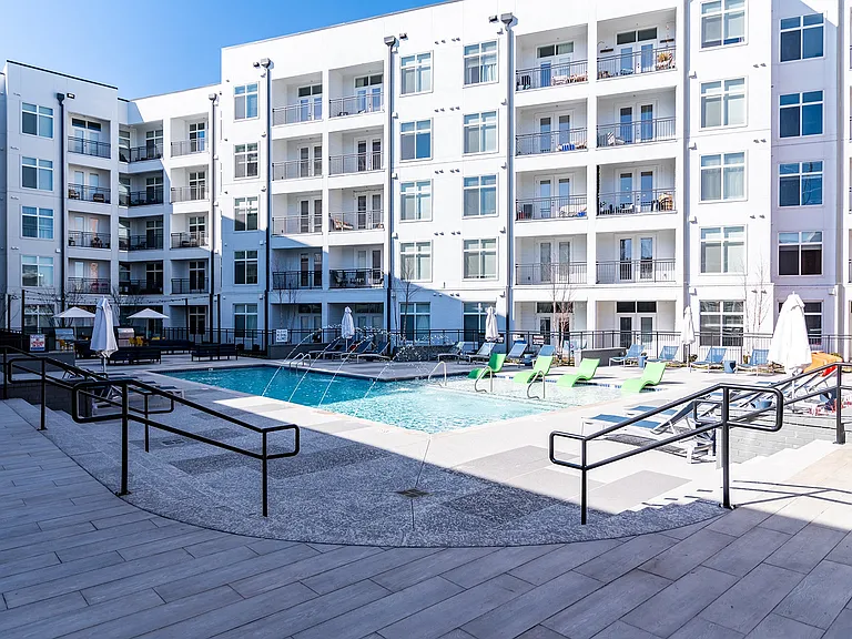Resort-style Swimming pool with Tanning Ledge and Expansive Sundeck