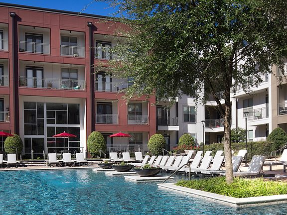 Resort-style swimming pool with tanning shelf