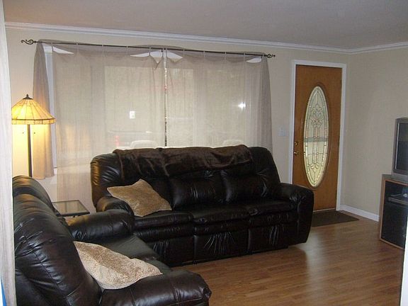 Pergo flooring in this bright and cheerful Living Room