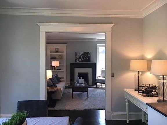 View from kitchen to living room. Note beautifully restored 