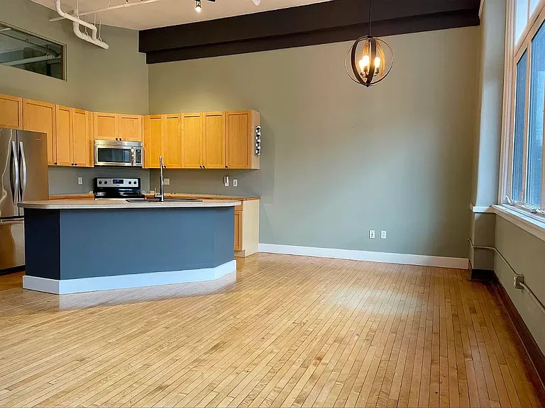 Huge living space. A loft condo, you will never feel that this place is too small because of the very high ceiling.