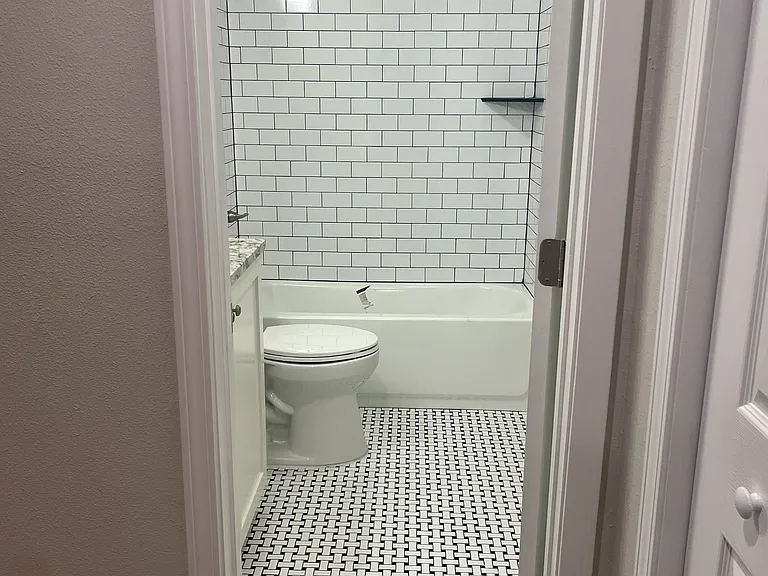 Beautifully renovated en-suite bathroom, featuring all-new amenities for a luxurious and modern experience.