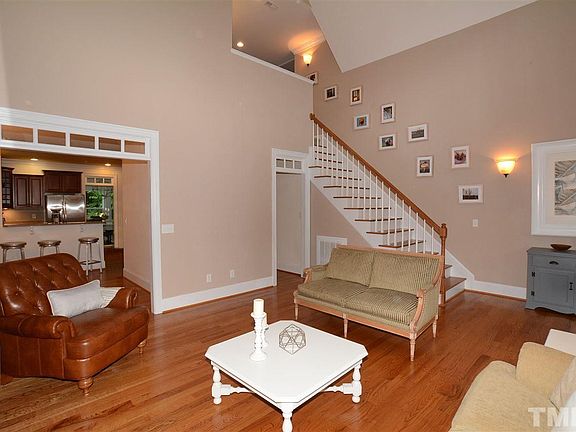 This View shows the Gleaming Hardwoods & the Open Loft Area at the top of the Stairs. The Living Room opens to the Dining & Kitchen making it a favorite floor plan for entertaining.