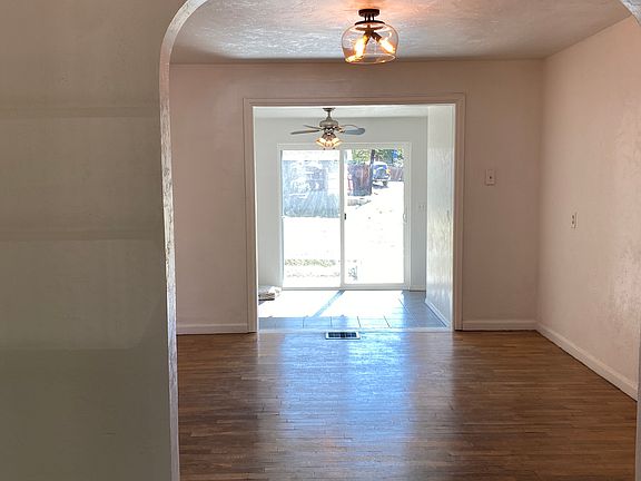 Living room looking into dining room and office/bonus room