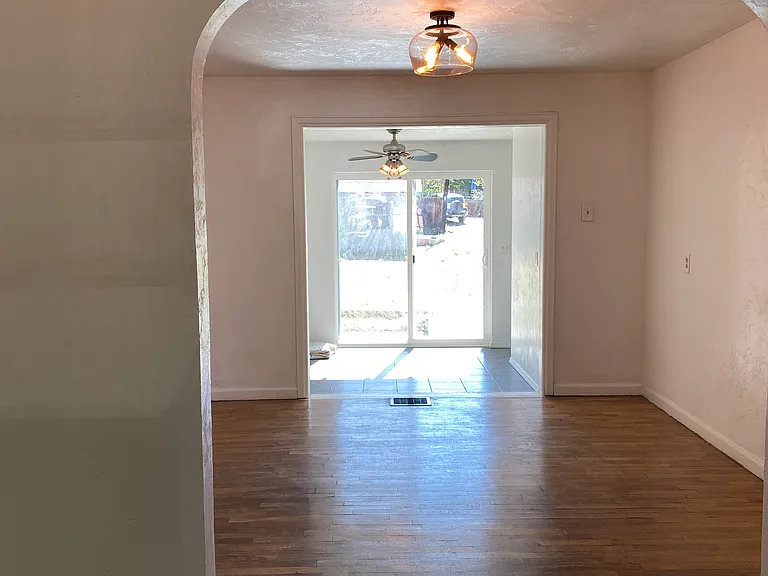 Living room looking into dining room and office/bonus room