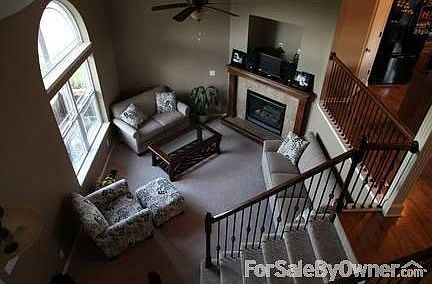 Front room including gas fireplace
						:
						Entry on the left, kitchen on the right