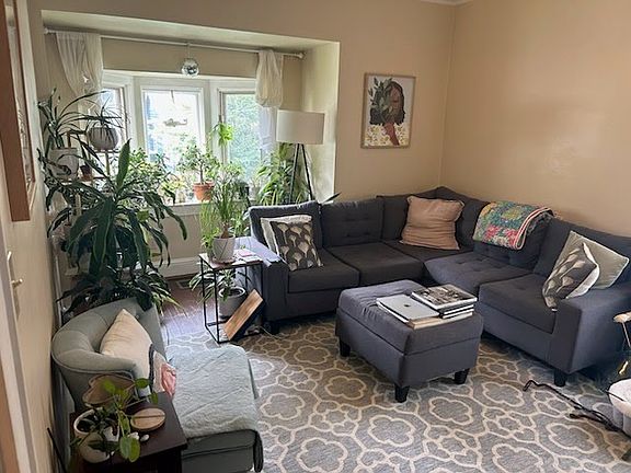 Living room with bay window facing the street.