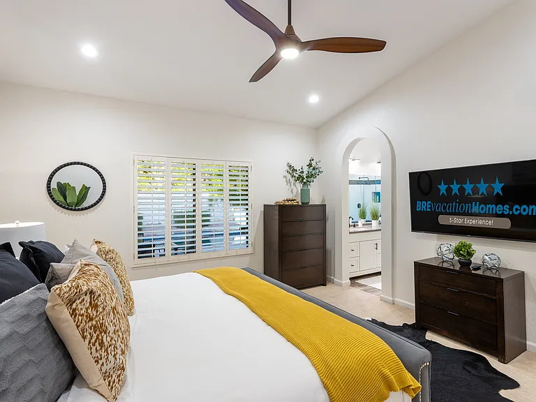 Primary Bedroom: 65" Smart TV + En-Suite Bathroom