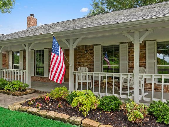The front porch is the perfect spot for relaxing and enjoying the breeze. Watch the birds and the squirrels scurry through the front yard and around the lawn.