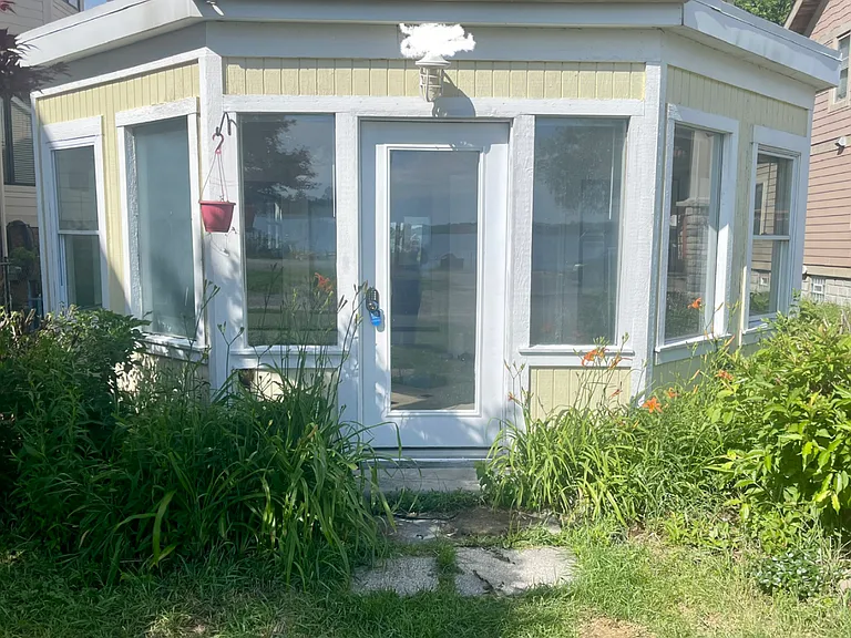 Front door and windows. Beautiful flowers. Summer vibes all year long