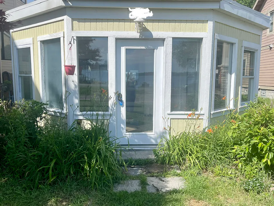 Front door and windows. Beautiful flowers. Summer vibes all year long