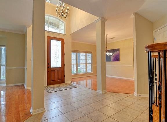 Views from the foyer into the formal living and formal dining spaces.