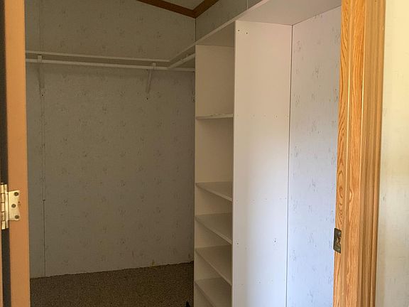 Walk-in closet off of Master Bedroom.