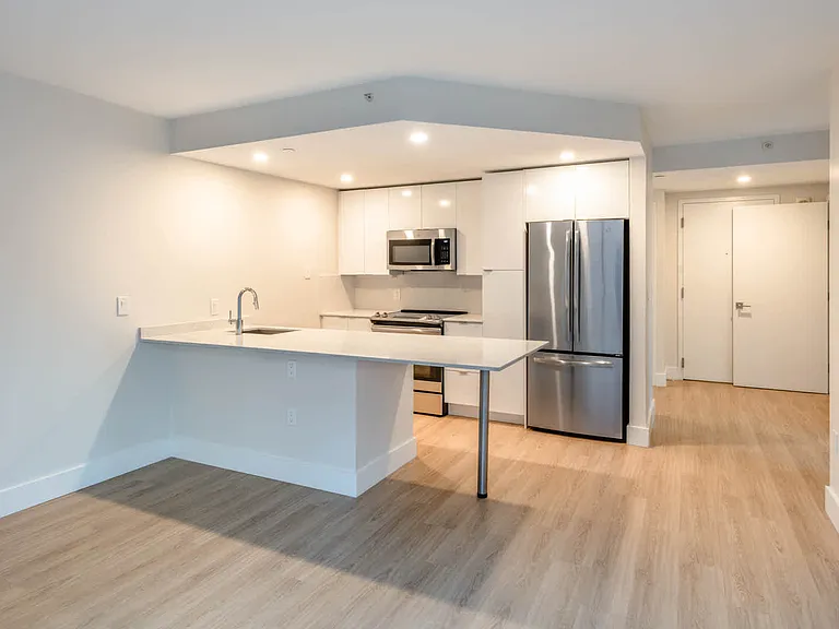 Kitchen with Breakfast Bar and Stainless Steel Appliances