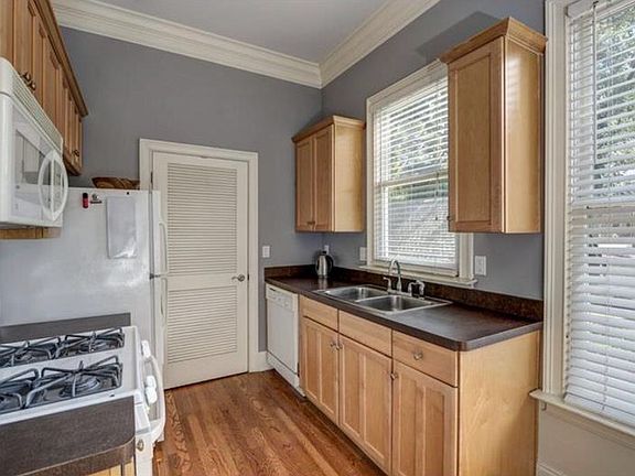 Kitchen equipped with pantry, gas range/oven, dishwasher, microwave, and refrigerator