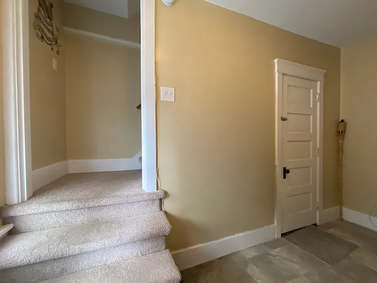 Entryway / Mudroom - Entrance to basement with Washer/Dryer hookup