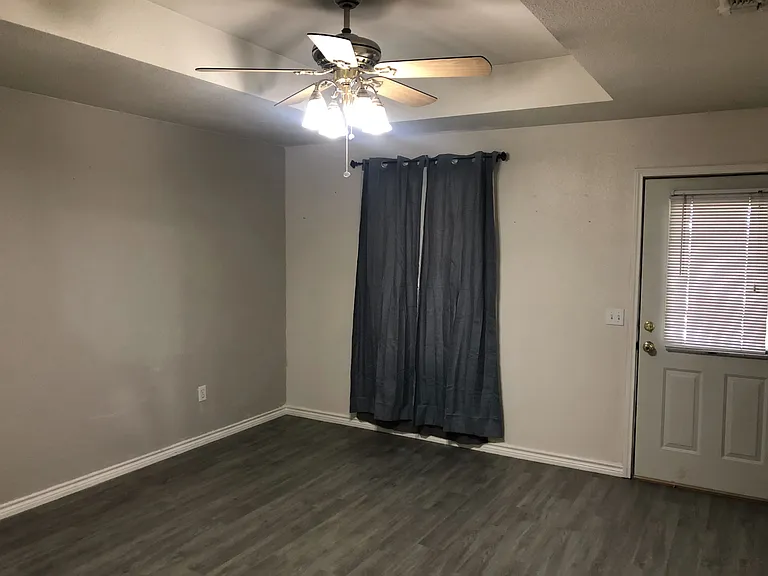 Primary Bedroom 13' x 14' with window and access to covered back porch