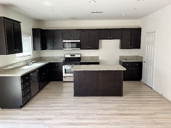 Kitchen with Granite Countertops and walk-in pantry