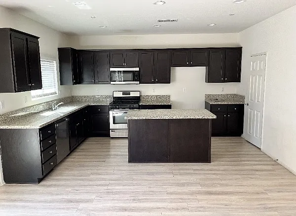 Kitchen with Granite Countertops and walk-in pantry