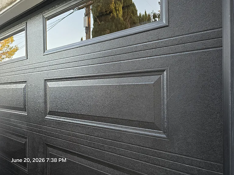 This is a close up of the new insulated garage door by COSTCO