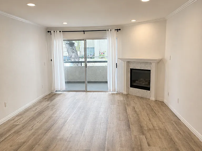 Large Living room with upgraded flooring and recess lights throughout the house