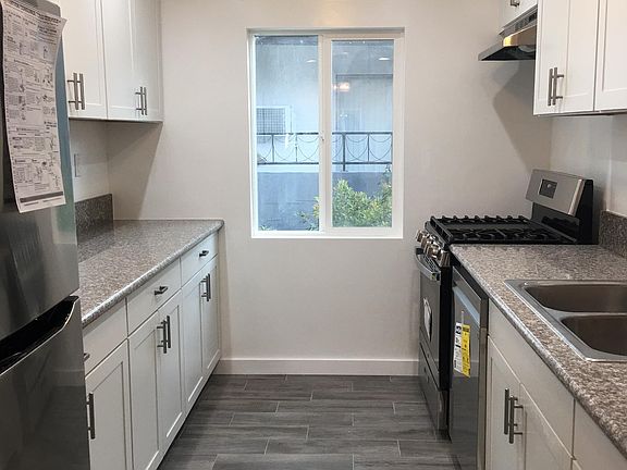 Remodeled kitchen with new appliances and new flooring throughout. Recessed lights.