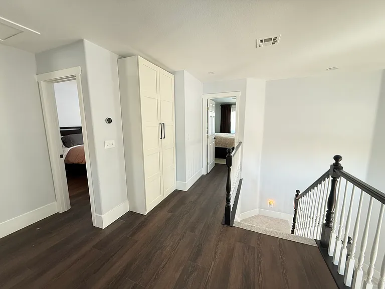 View of second room for rent (left), linen cabinet (middle) and master bedroom (right). Master bedroom occupied by owner resident.
