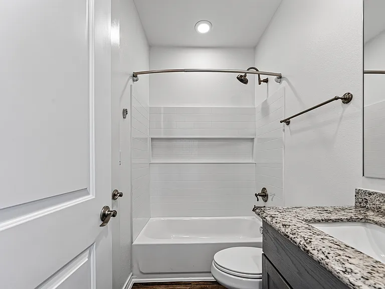 Private ensuite bathroom with modern finishes.