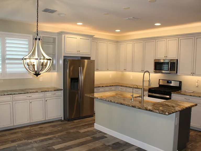 Upgraded cabinets, fixtures and countertops with accent dimmable lighting