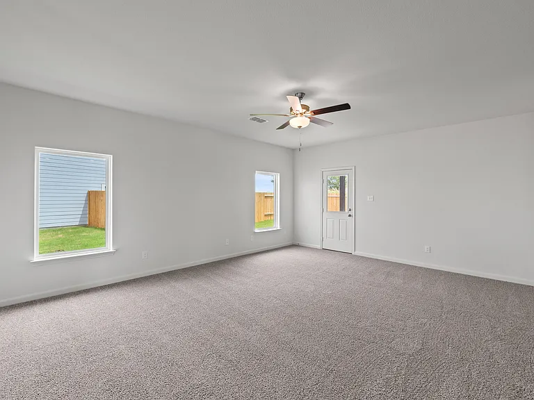 The spacious family room is perfect for family living and hosting.