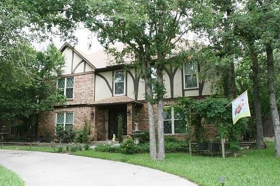 Beautiful trees shade the entry.