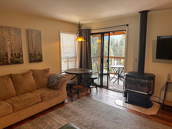 Living area with exterior deck and gas fireplace