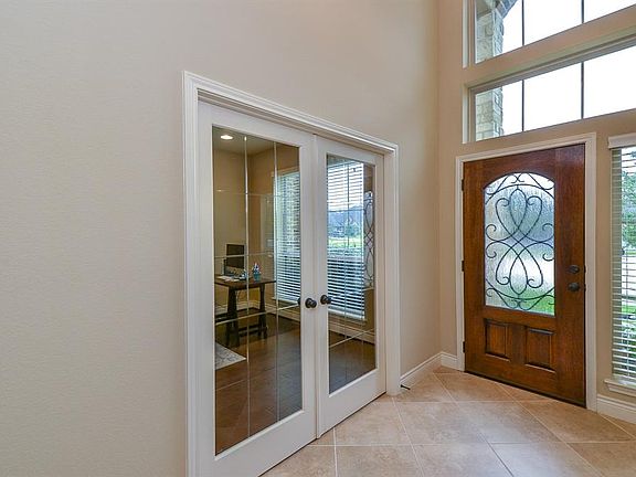 Library/Study w/ glass privacy doors, perfect for working from home