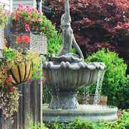Mermaid Fountain in front of building.