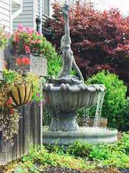 Mermaid Fountain in front of building.
