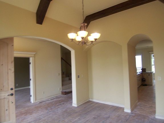 Formal Dining has cathedraled ceiling accented with distressed beam work.