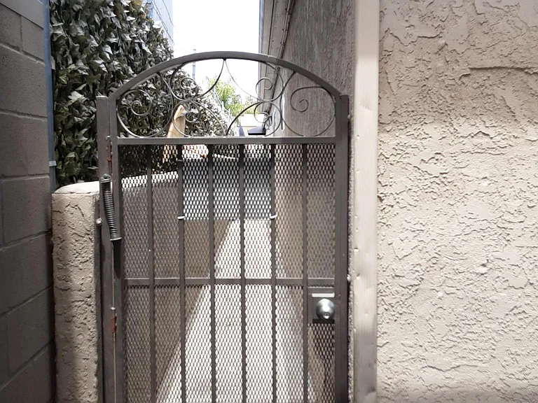 Security gate entrance from alley 7200 El Cajon Blvd South Alley