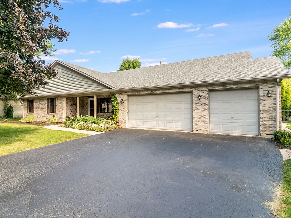 Cedar and Brick front. Covered Front Porch