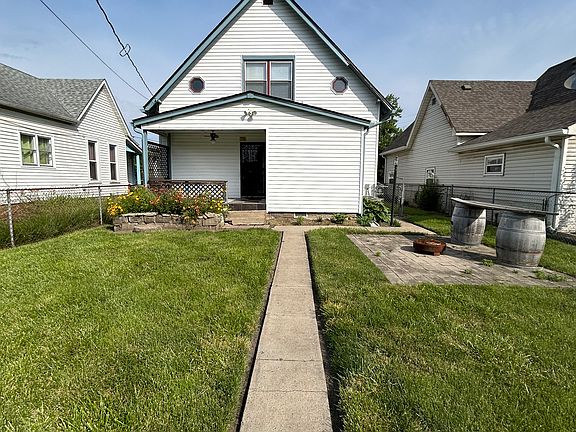 Fenced in back yard with back porch