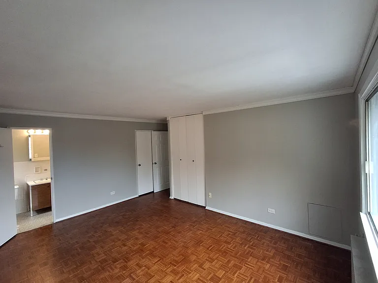 Primary Bedroom with view of full bathroom