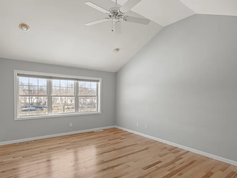 Primary bedroom with a view of the Winooski River.