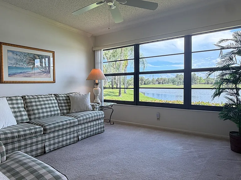 Cozy up to STUNNING lake & golf course views from the living area!