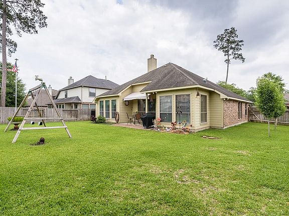 The covered patio has a retractable awning.