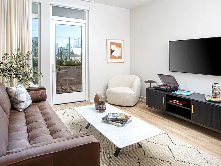 Apartment homes with private balconies and spacious light-filled living areas