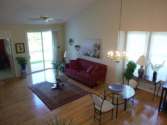 Vaulted ceiling and fan,  Hardwood floors and slider to Patio