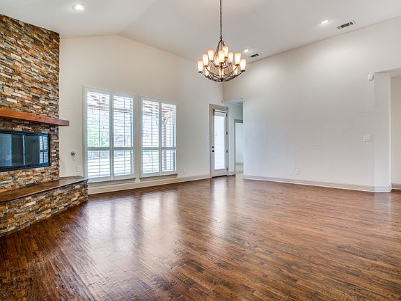 The living room offers seamless access to the backyard and primary suite_perfect for both everyday comfort and entertaining flow.