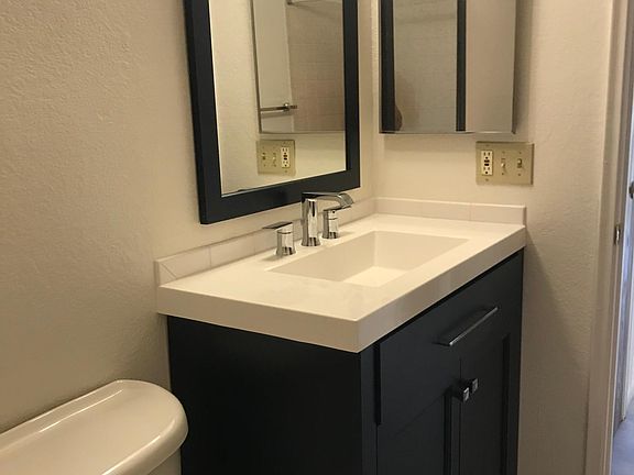 Bathroom with new vanity and mirror