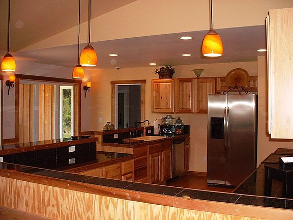 Lots of granite tile countertop and bar top!